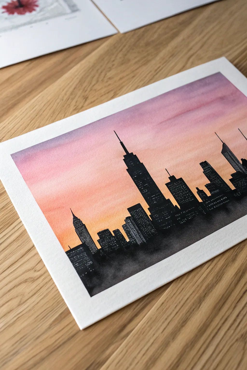 Cozy girls night skyline silhouettes: simple dark shapes over a dreamy sunset gradient wash