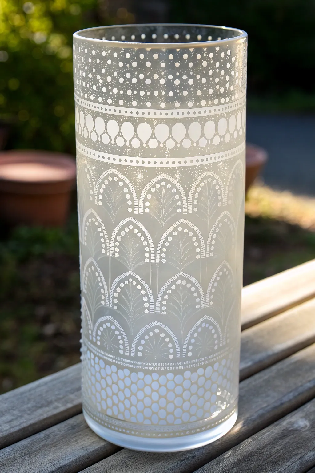 Crisp stencil bands on a clear glass vase for clean, minimalist pattern rhythm