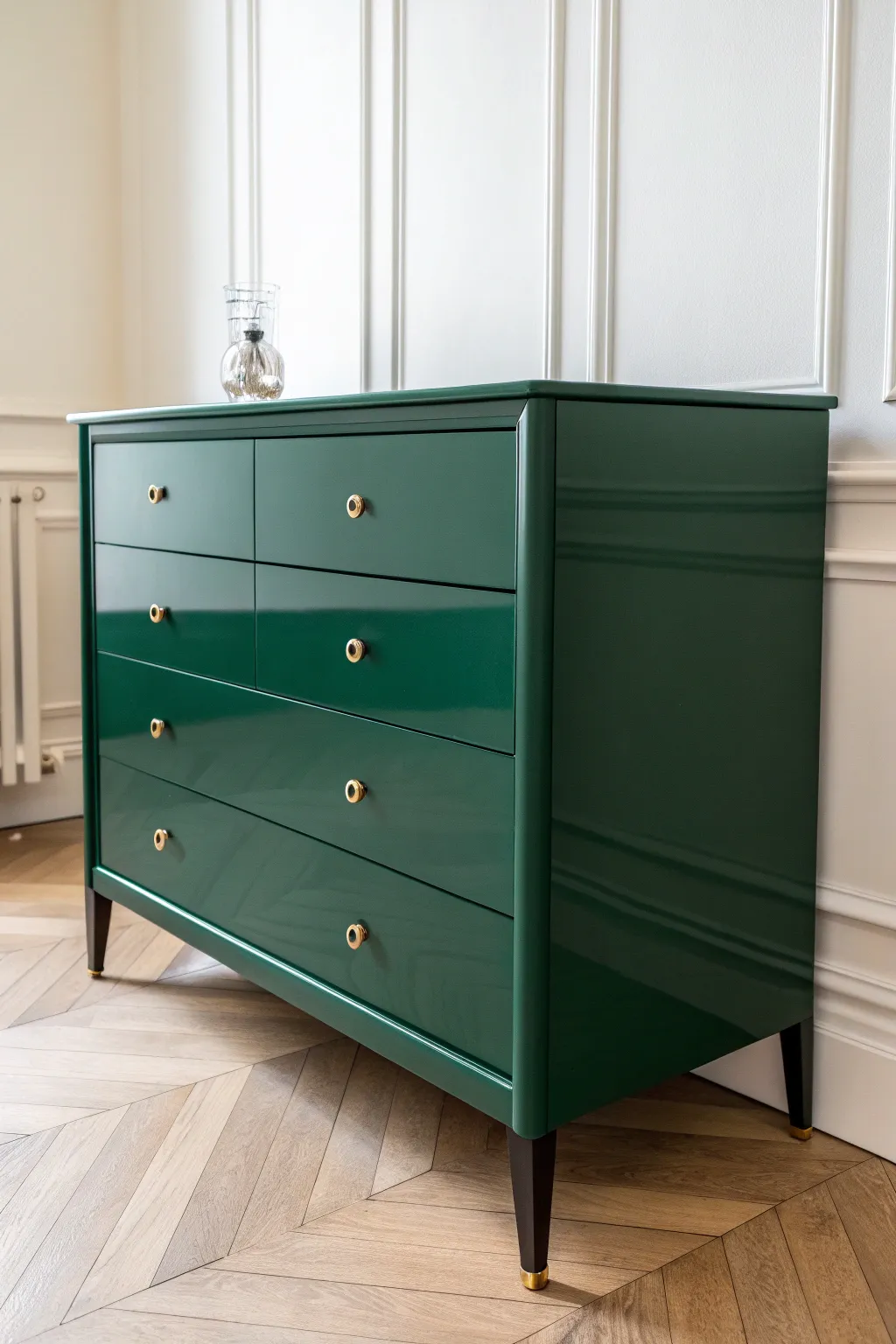 Emerald high-gloss dresser that catches the light for a bold, modern green statement.