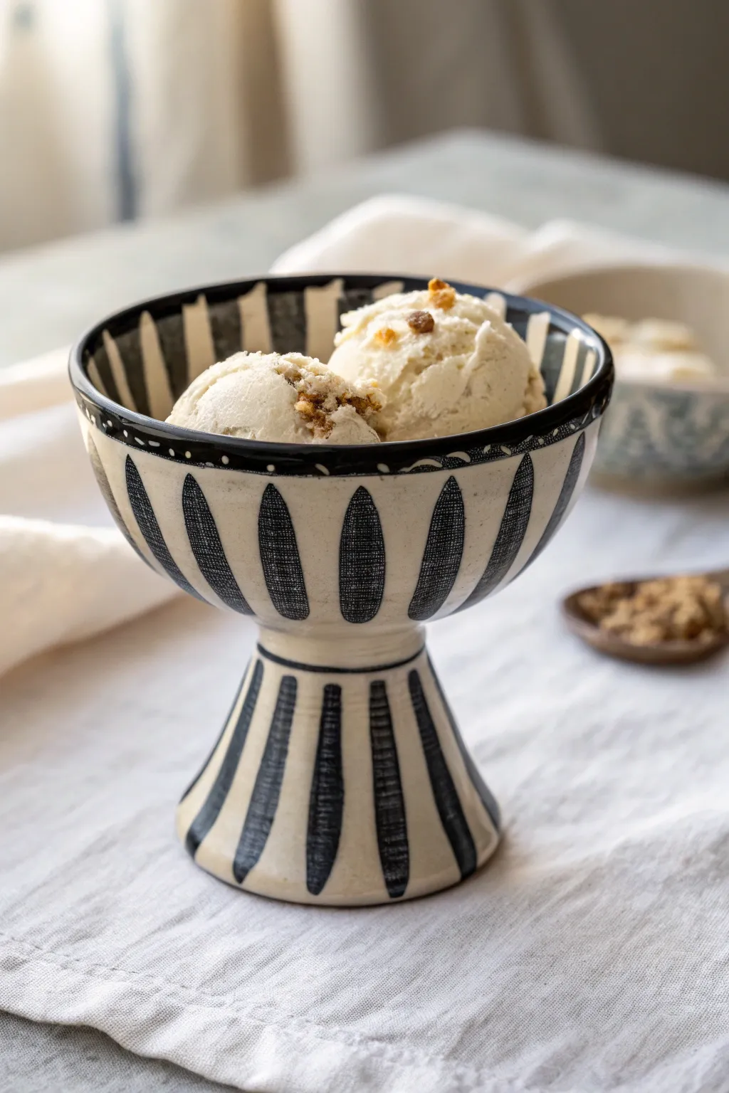 Classic diner stripes on a pedestal sundae bowl, with a tiny sprinkle detail for charm