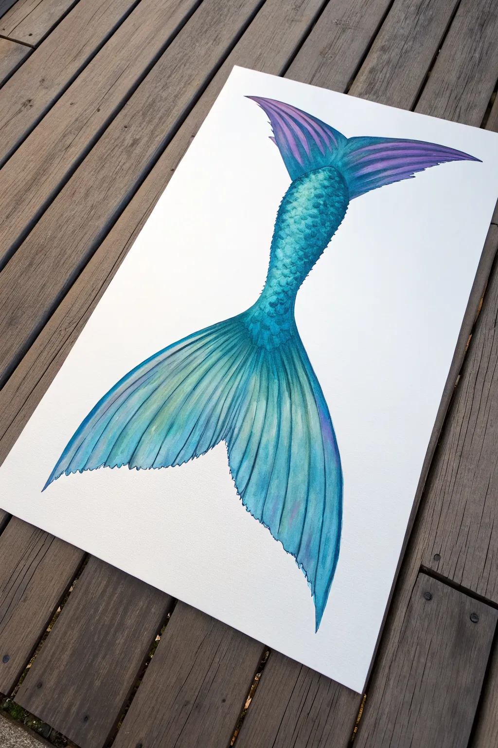 Sleek acrylic mermaid tail with smooth ombré blends, glossy highlights, and a softly glowing fin.