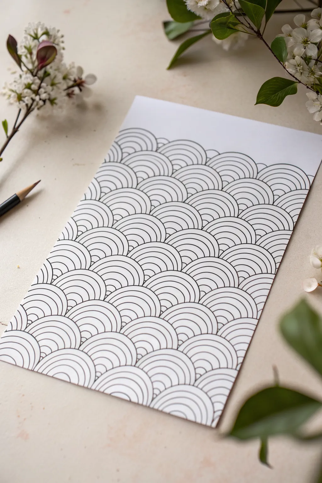 Crisp black ink wave curves that create a clean op art ripple illusion, shot perfectly overhead