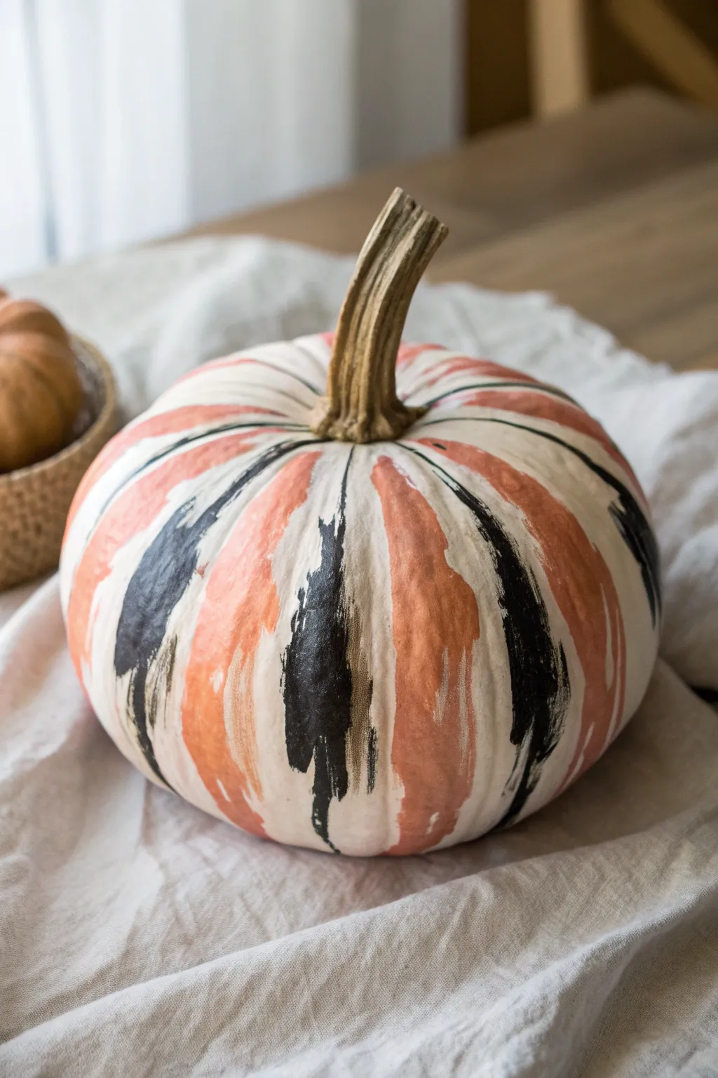 Bold abstract acrylic brushstrokes transform a pumpkin into chic minimalist fall art.