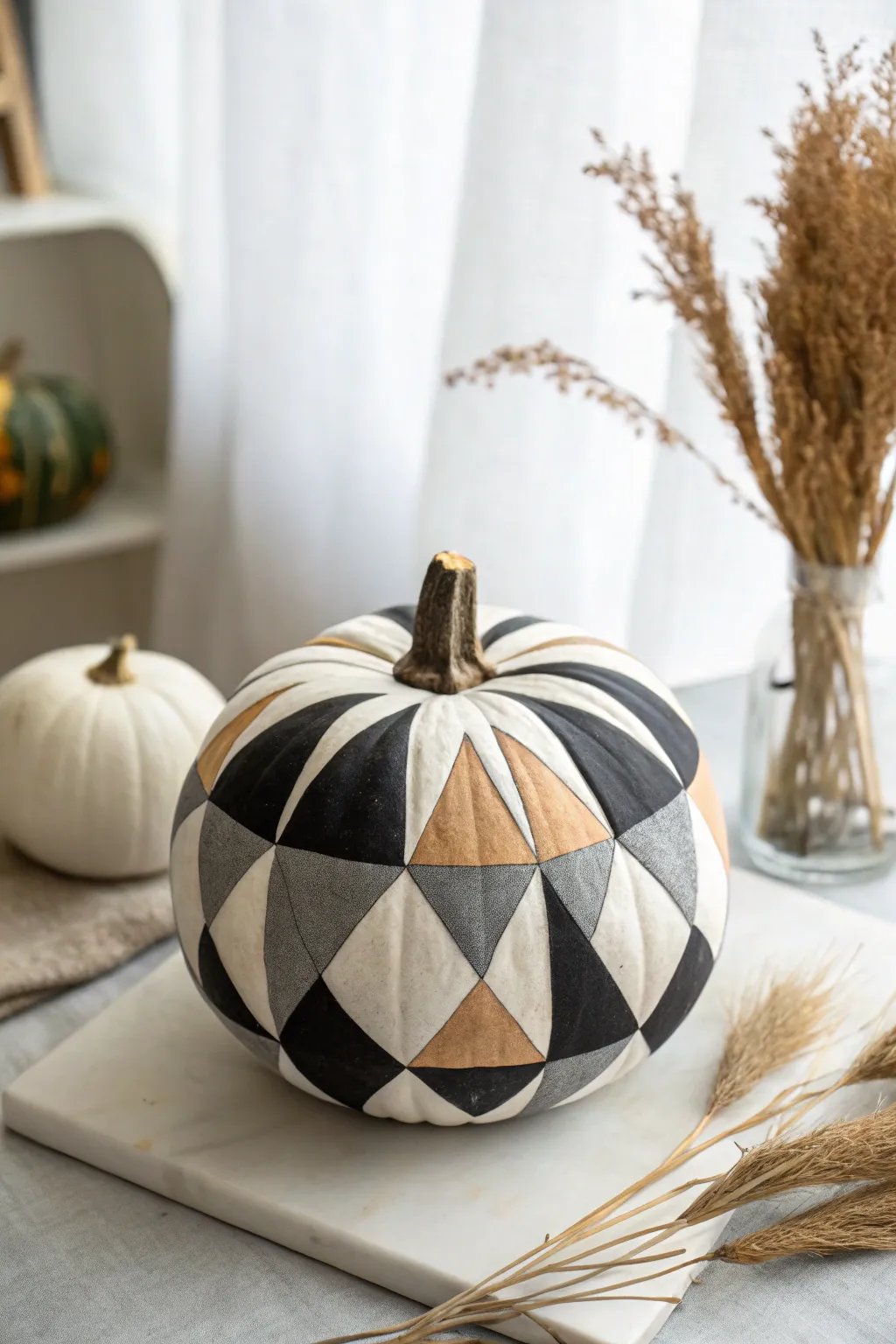 Minimalist geometric pumpkin in grayscale for a bold, modern fall painting idea for men.