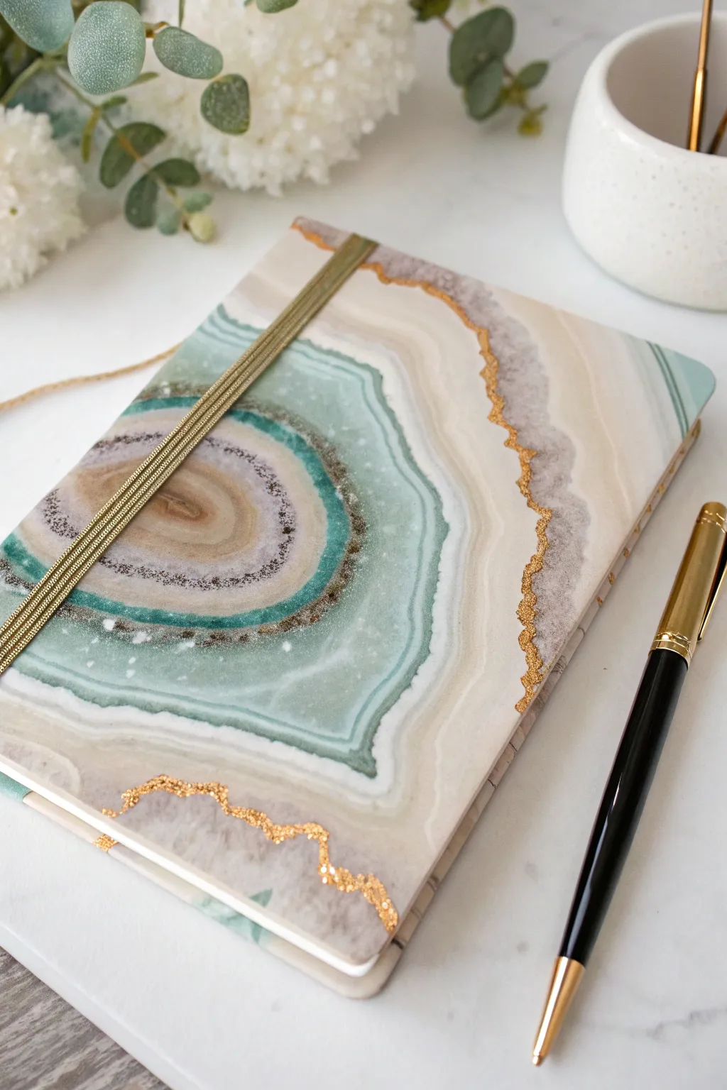 Geode agate resin notebook cover with soft bands and a gold metallic edge for subtle shine