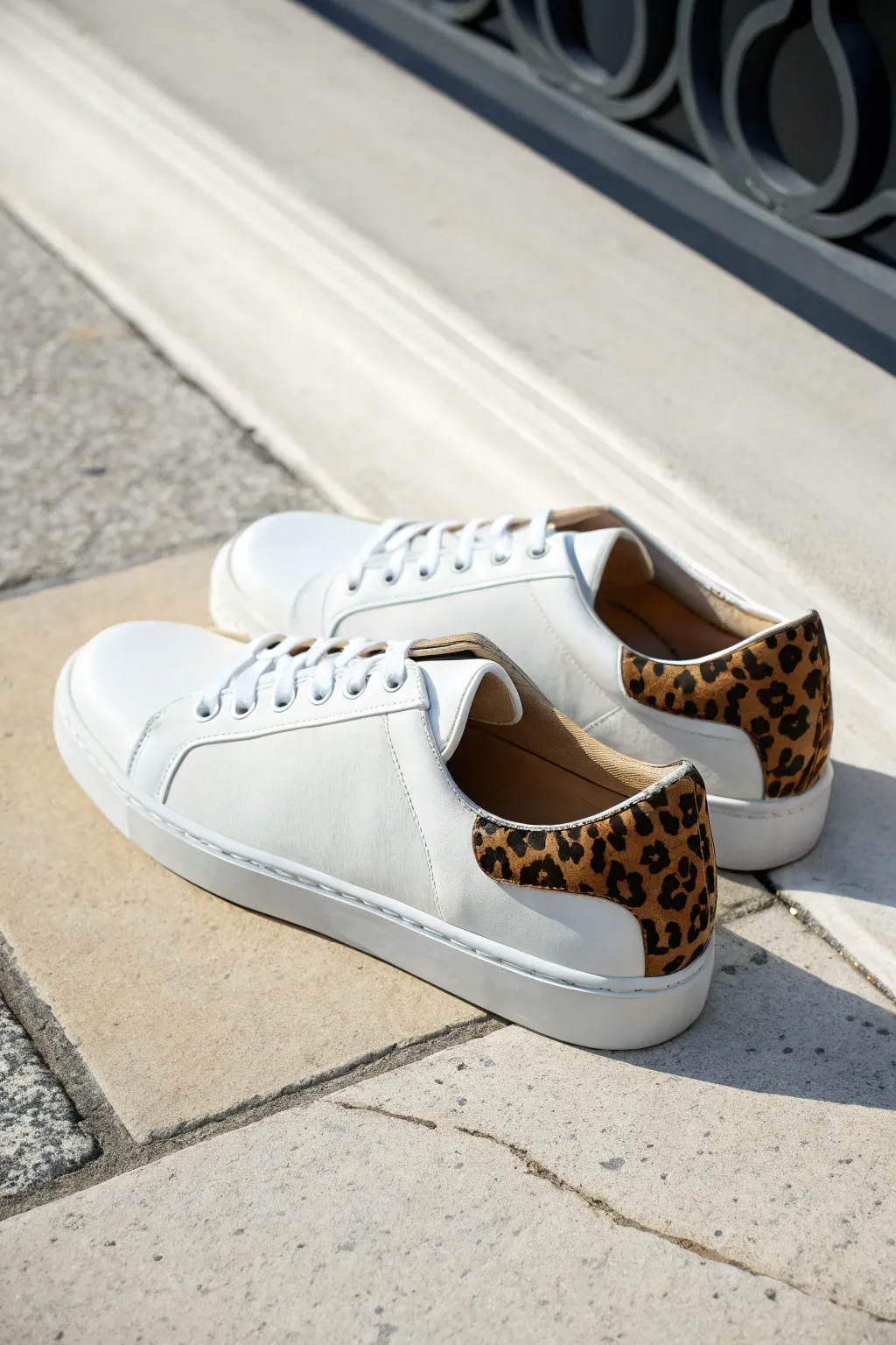 Hand-painted animal print side panels turn simple sneakers into chic, wearable statement art.