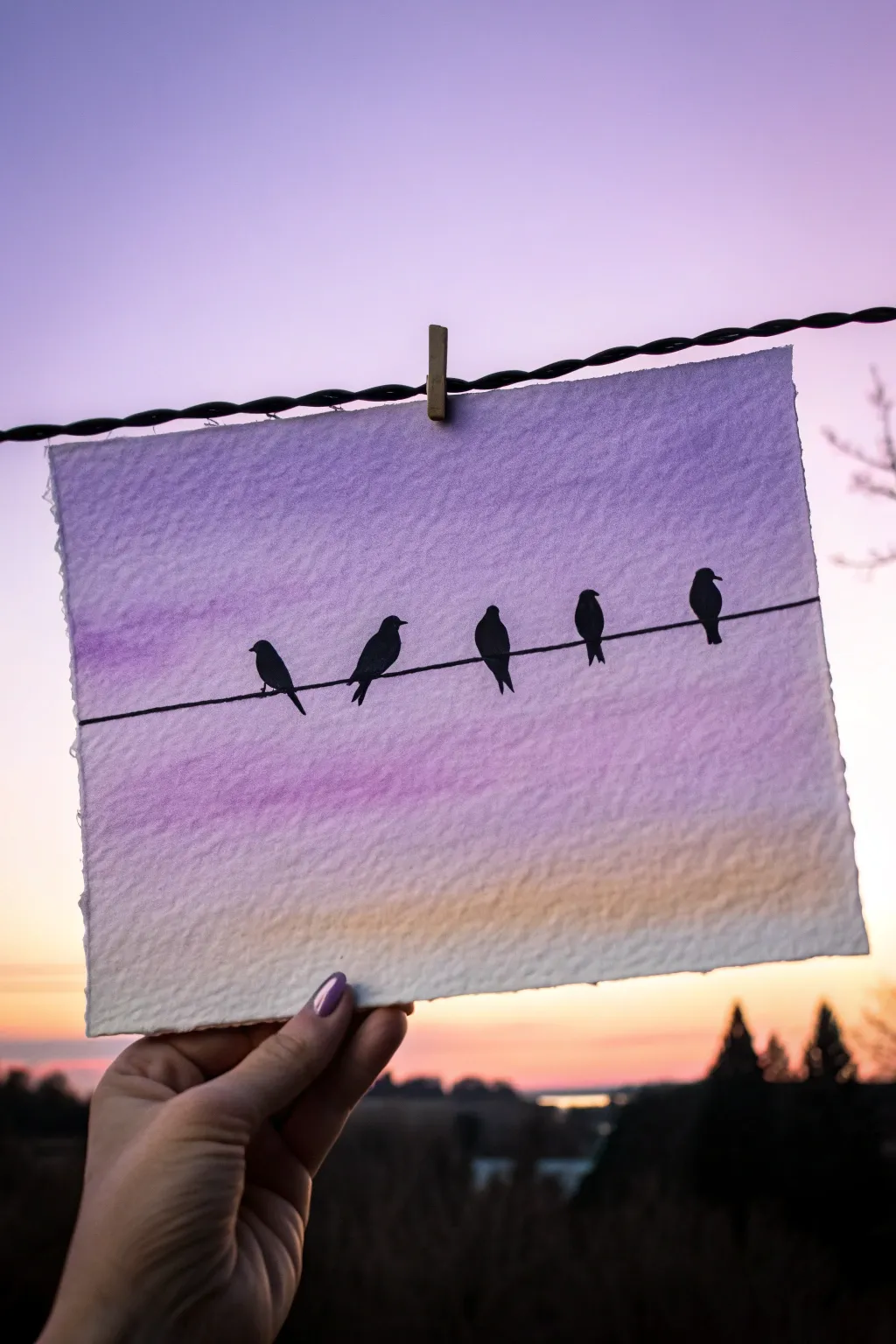 Birds on a wire silhouette painting with a soft twilight gradient and crisp, minimal contrast