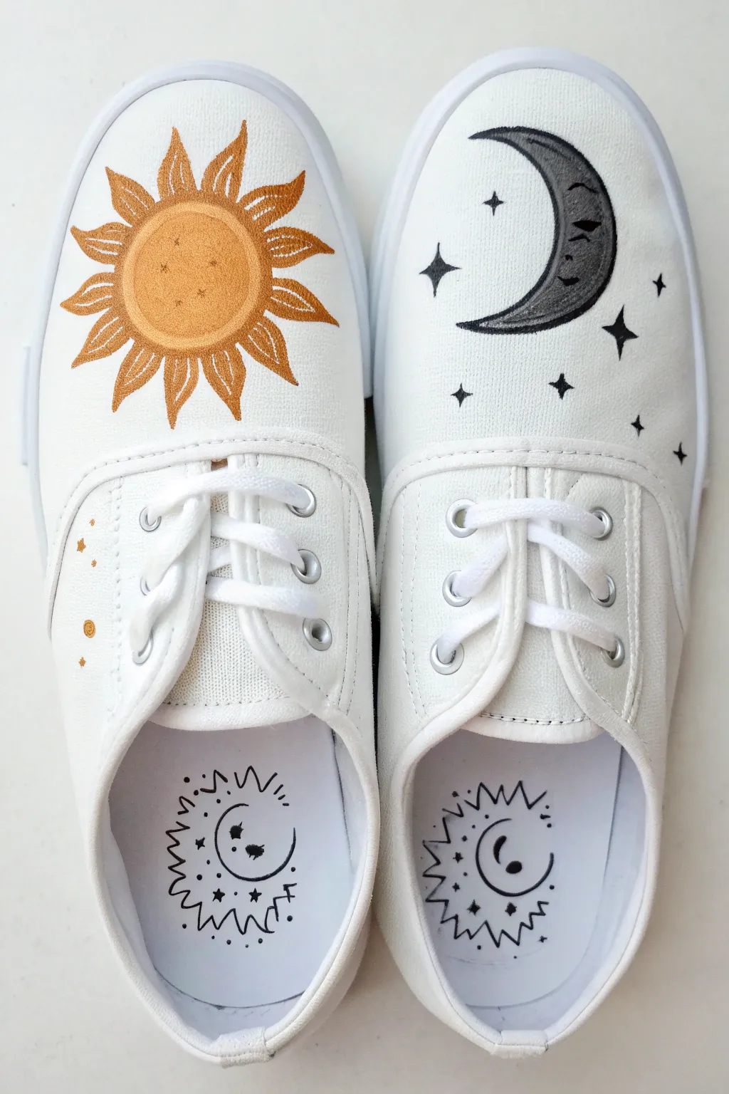 Minimal sun and moon shoe painting idea: bold icons, calm neutrals, crisp handcrafted contrast