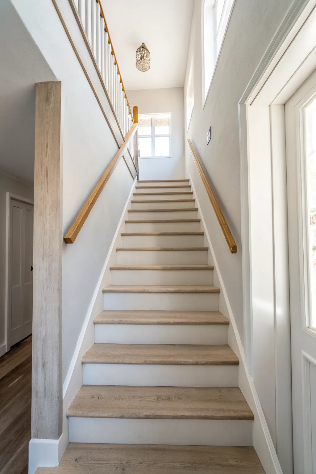 Paint stairs and the adjoining wall the same shade for a calm, seamless flow upstairs