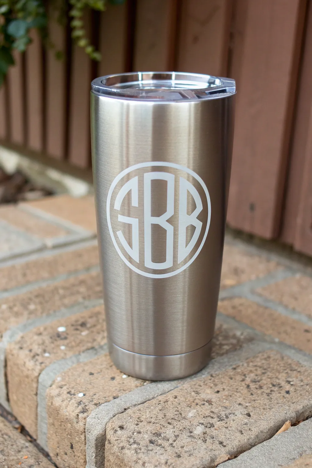 Peel-and-reveal vinyl stencil detail for a crisp monogram-style tumbler painting idea