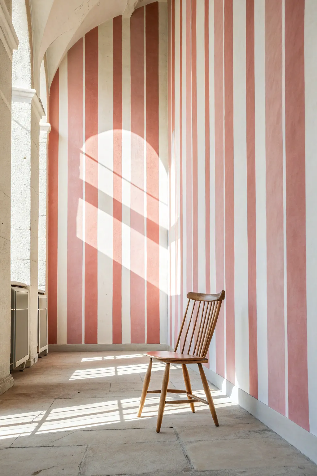 Create the illusion of soaring height with these elegant blush vertical stripes.