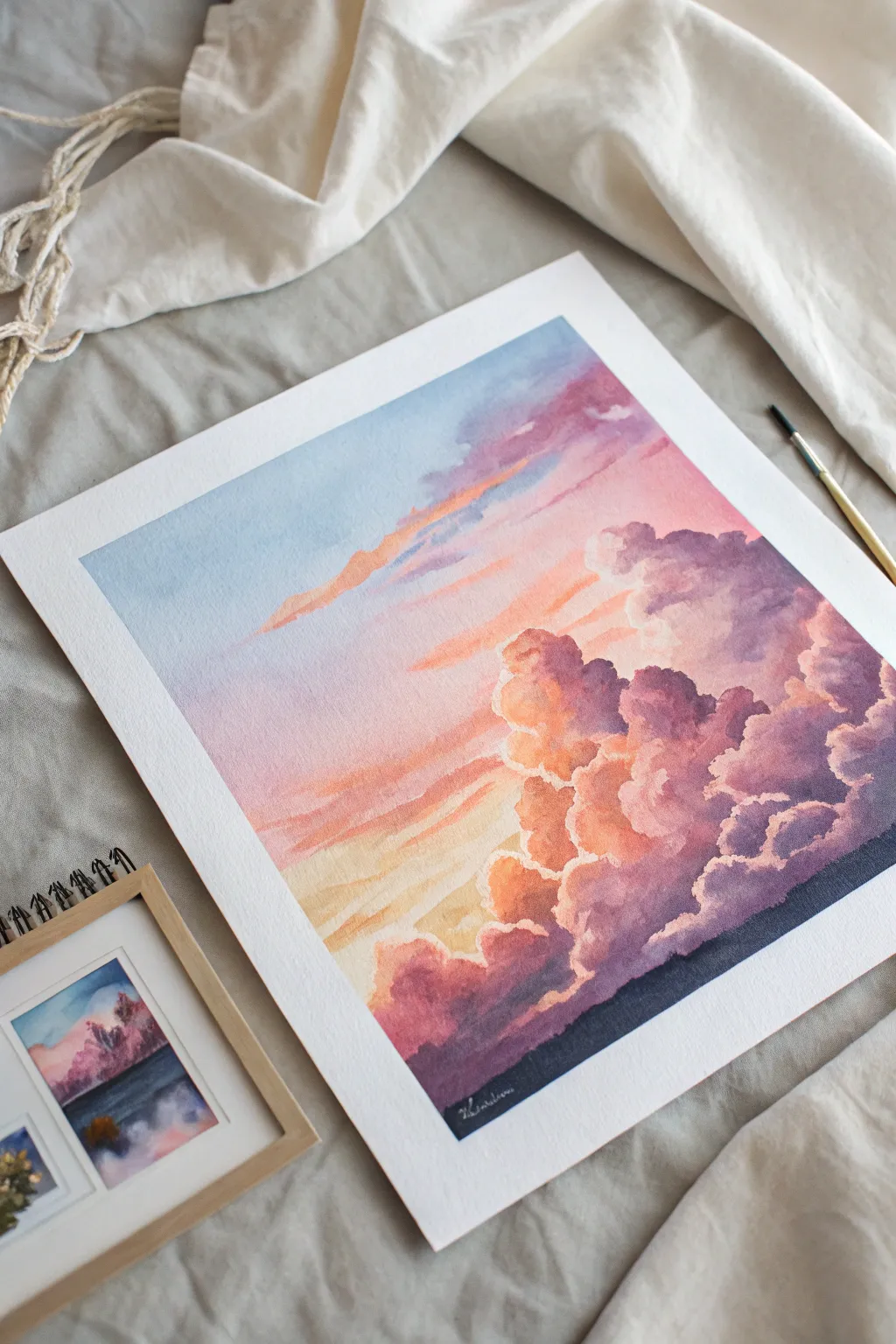Paint pillowy pink-peach clouds on a violet sky for an easy cotton candy sunset wash