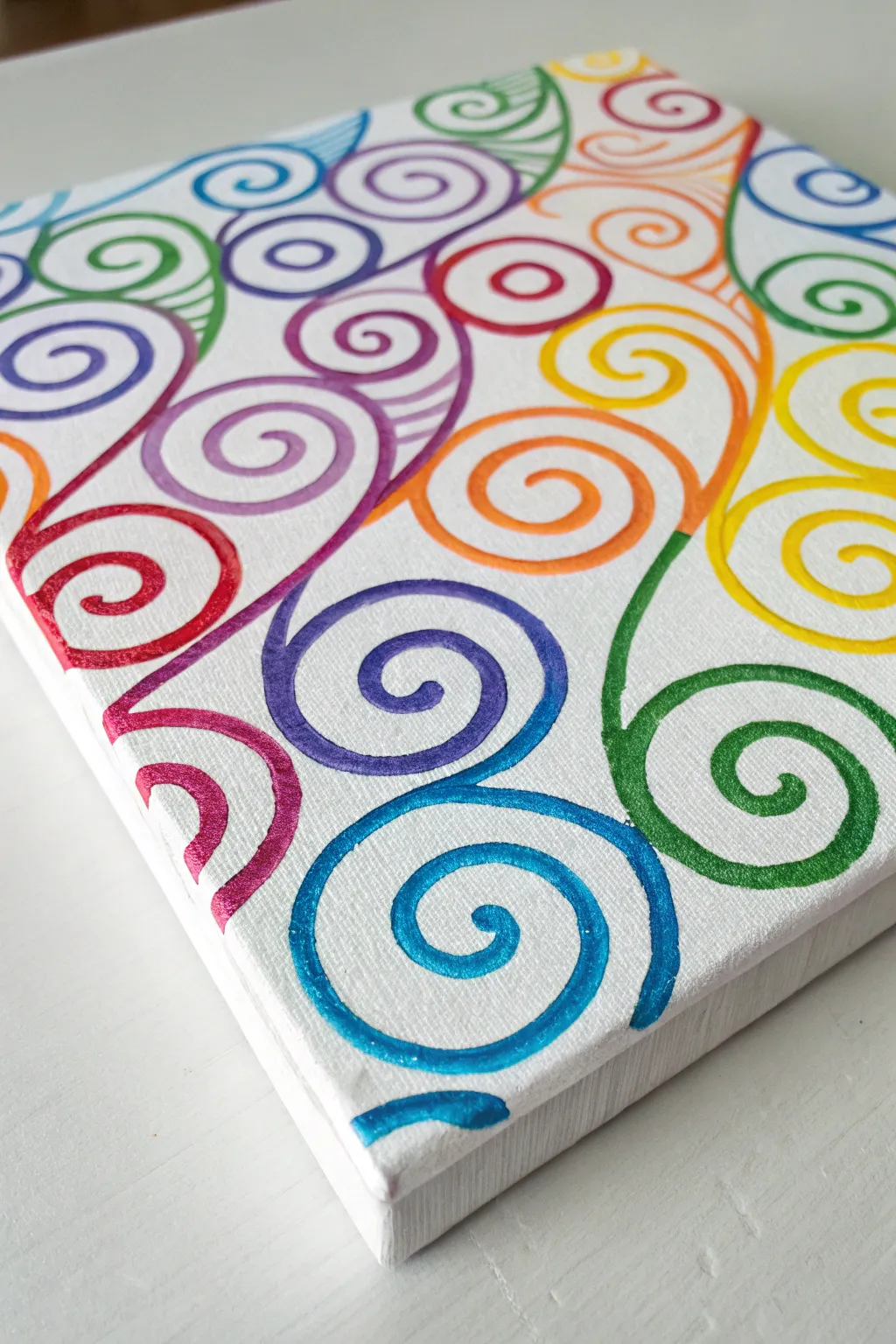 Rainbow squiggles in bold handcrafted color, a minimal Scandinavian-boho abstract art idea.