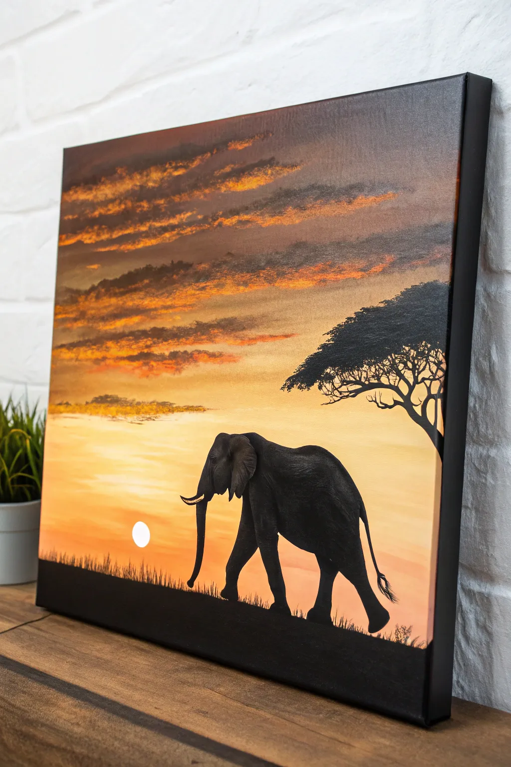 Minimalist elephant silhouette against a glowing sunset savannah gradient, bold yet serene.