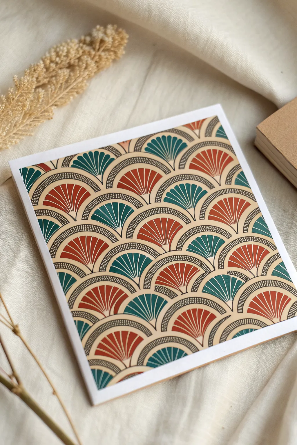 Scales meet petals in a calming repeat, with one shaded swatch revealing soft handcrafted dimension.