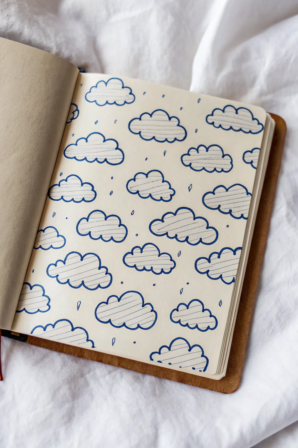 Sky-filling cloud scatter pattern: varied quick cloud shapes arranged like a simple repeating design.