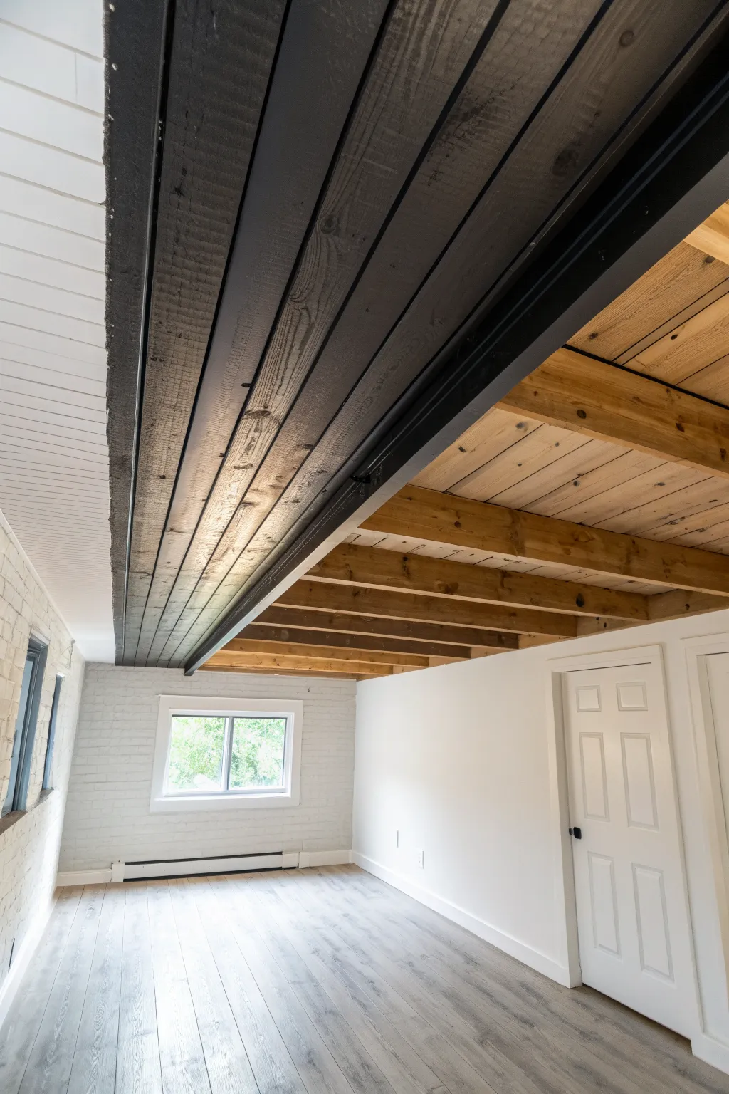 Light ceiling paint bounces brightness down, making a low basement feel instantly taller.