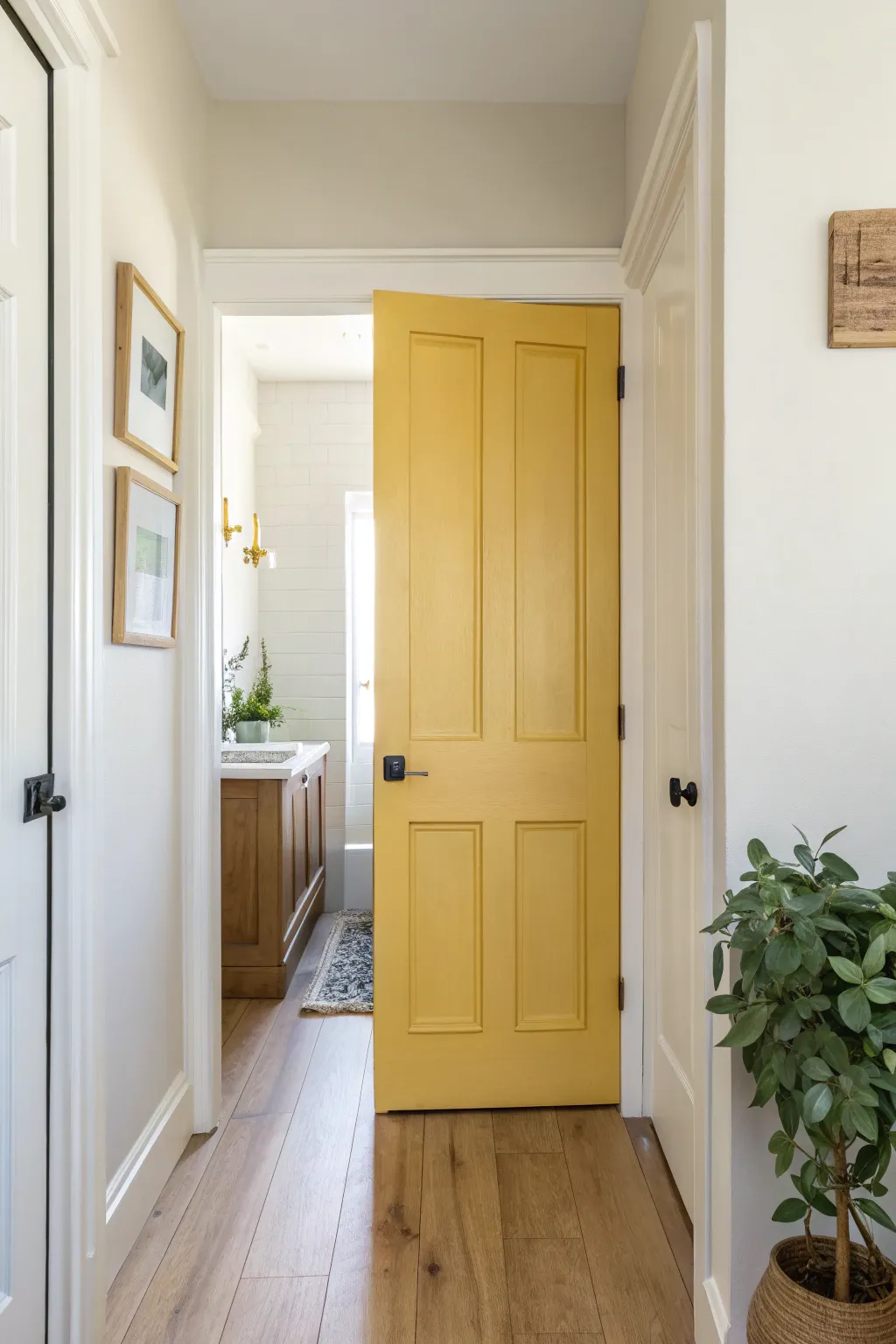 Butter yellow bathroom door for a sunny, tidy pop that brightens minimalist hallways.