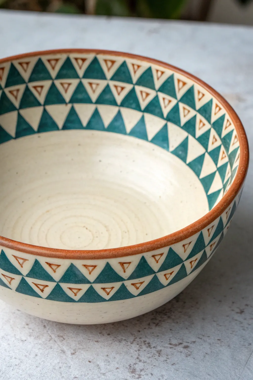 Beginner bowl painting: a simple ring of repeating triangles with bold, modern contrast