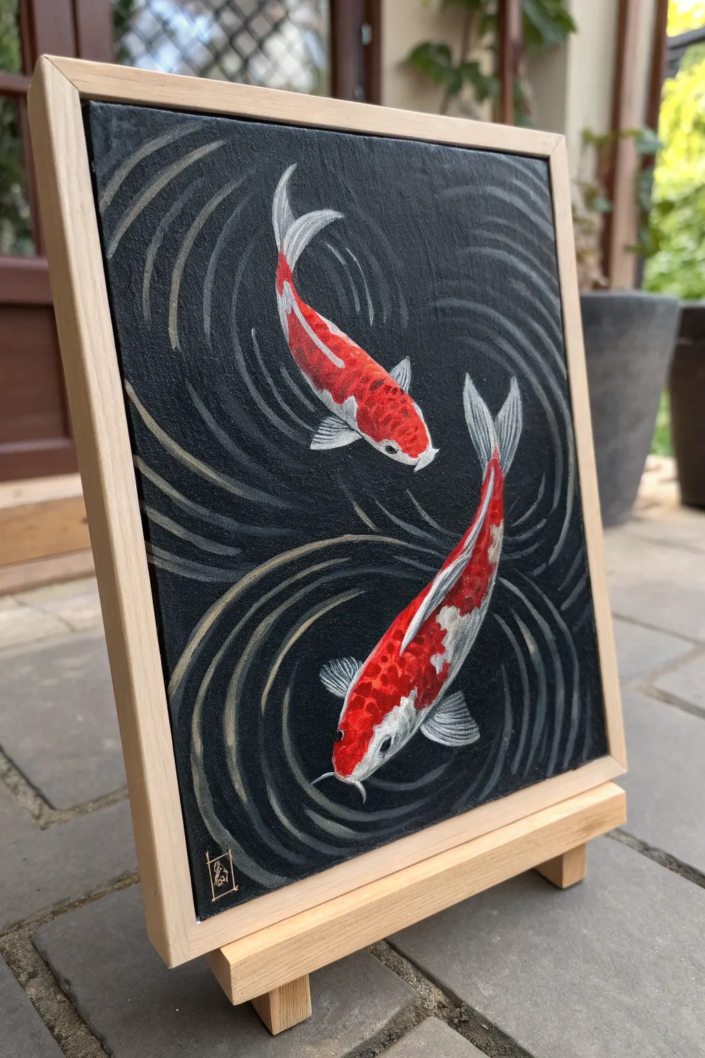 Red koi drifting through matte black water, a bold minimalist painting idea with calming ripples