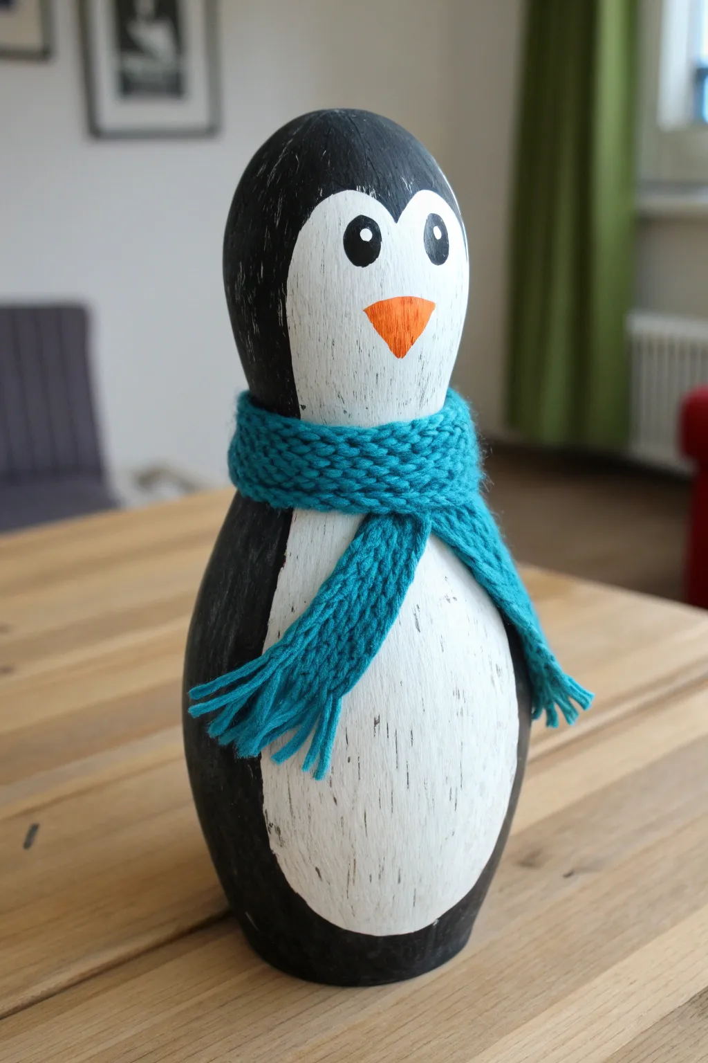 DIY penguin bowling pin with cozy scarf, minimalist Nordic style with a pop of bold color