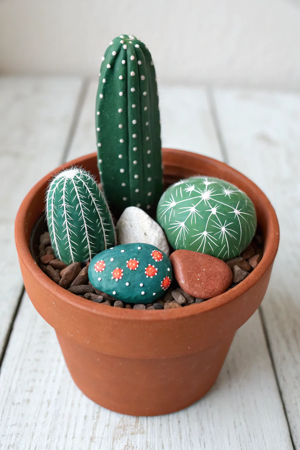 Mini cactus rock pot in bold desert hues, minimalist boho styling, crisp focus and contrast