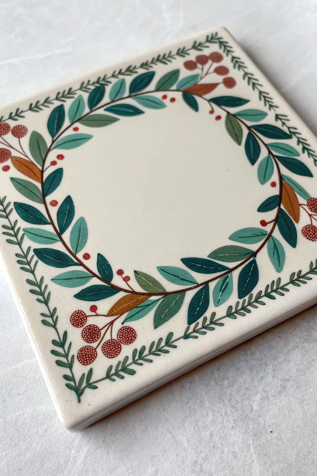 Botanical wreath border coaster: crisp greens, minimal lines, and a peek of sketch process.
