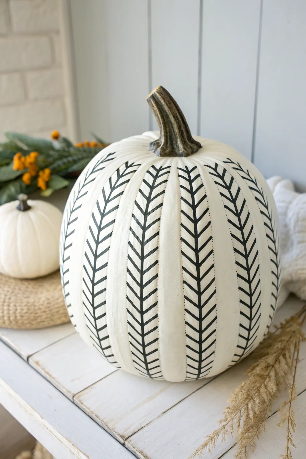 Chic white pumpkin with bold black herringbone for a timeless minimalist look