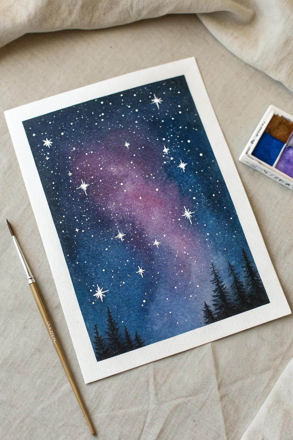 Galaxy night sky painting idea with splatter stars, bold blues and purples on clean minimal styling