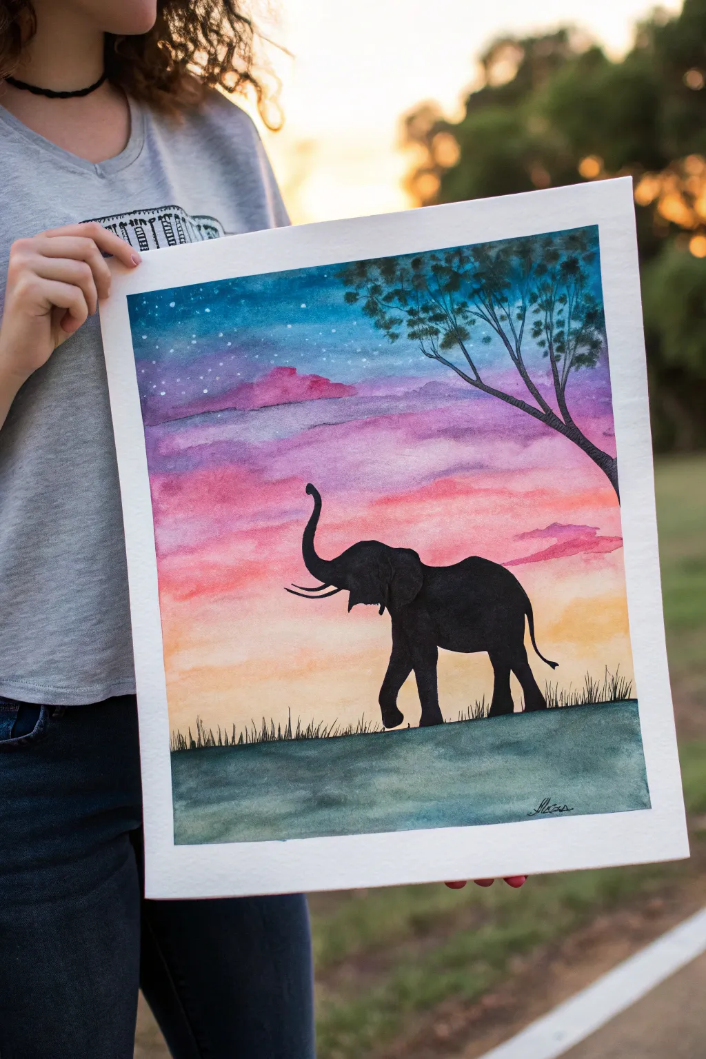 Minimalist elephant silhouette painting with a vivid glowing sunset sky for an easy art idea