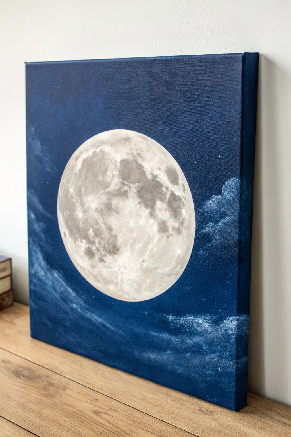 Minimal moon canvas with soft cloud smudges, bold contrast, and dreamy Scandinavian boho calm.