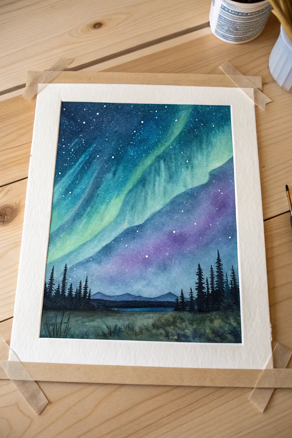 Crisp tape borders make your aurora sky look instantly polished with a clean horizon line.