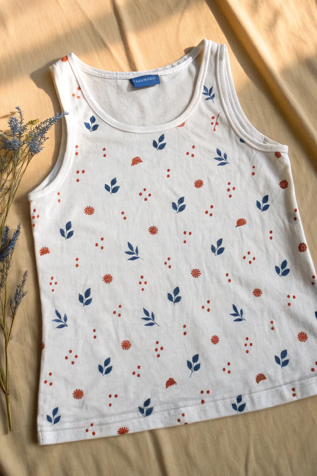 Evenly painted mini motifs across a simple tank top for an easy Scandinavian boho statement.