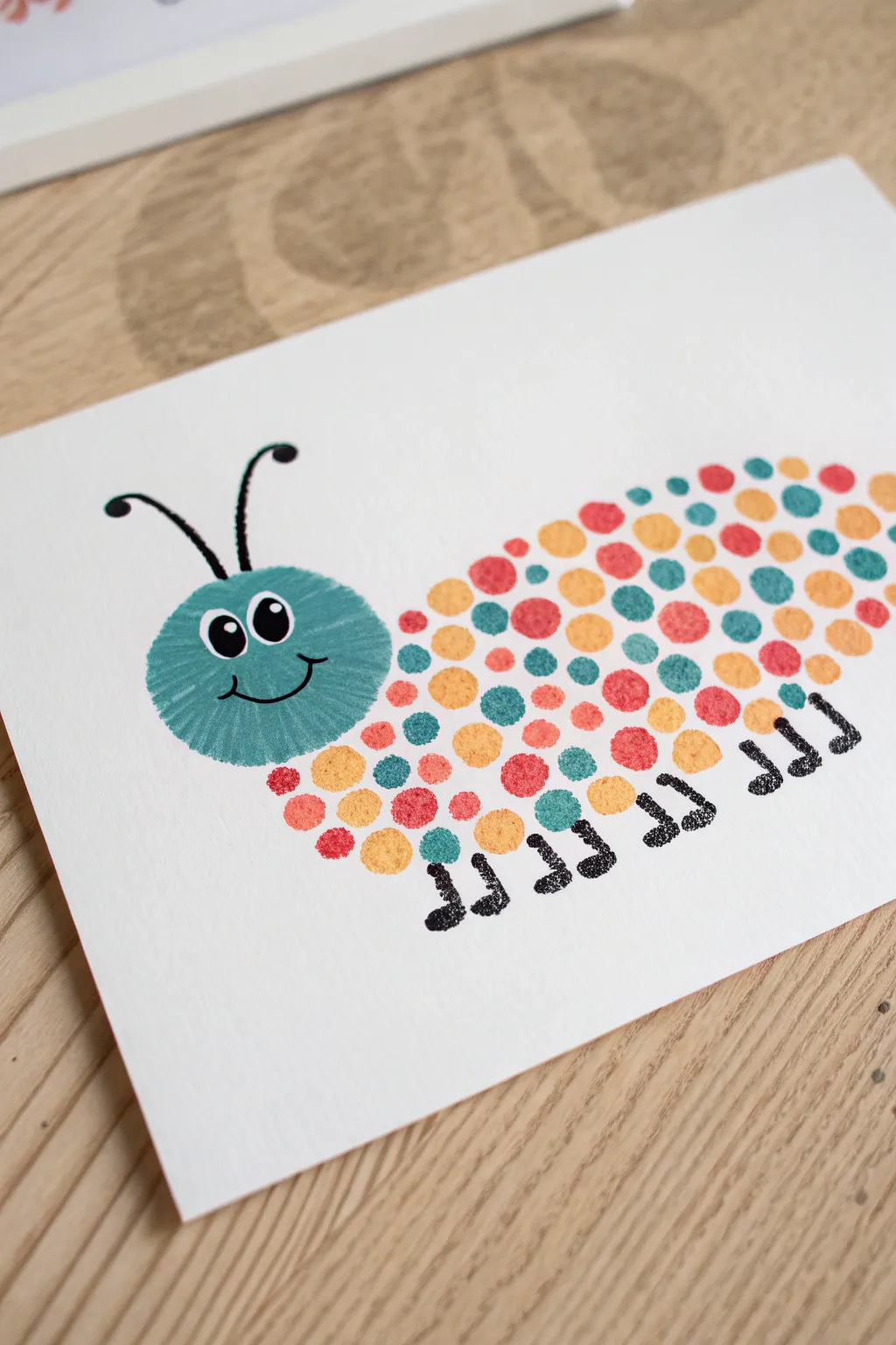 Adorable Love Bug fingerprint caterpillar: a bright, simple Father’s Day keepsake kids can make.