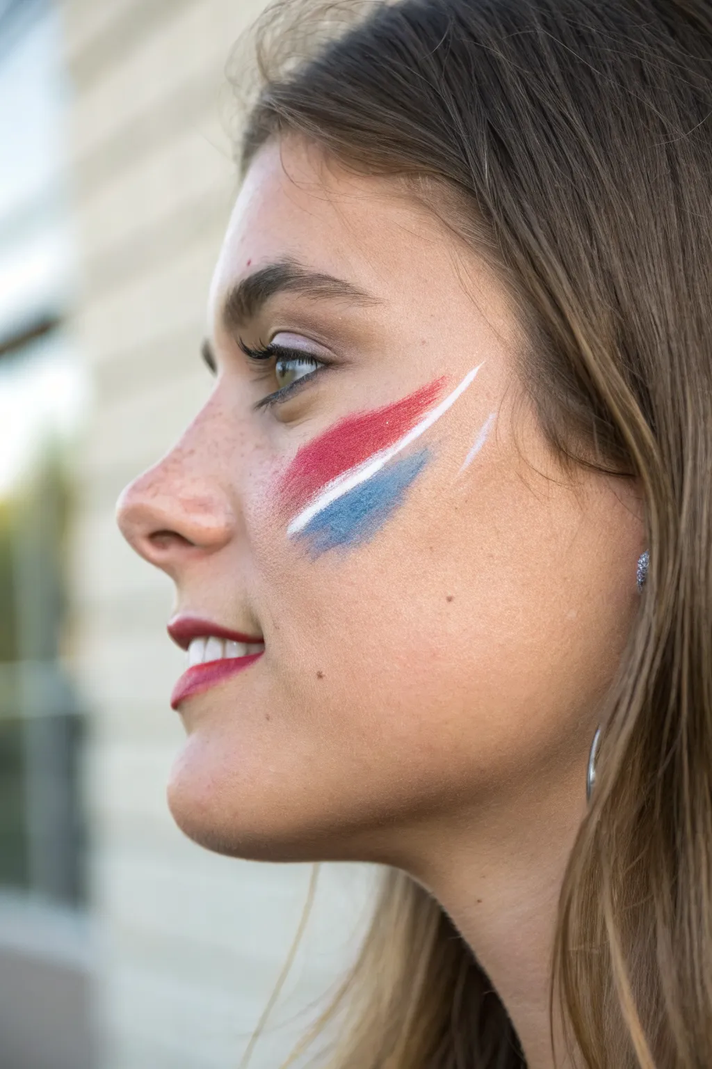 Ombre team-color cheek fade with a crisp highlight stripe for an instantly bold game day look