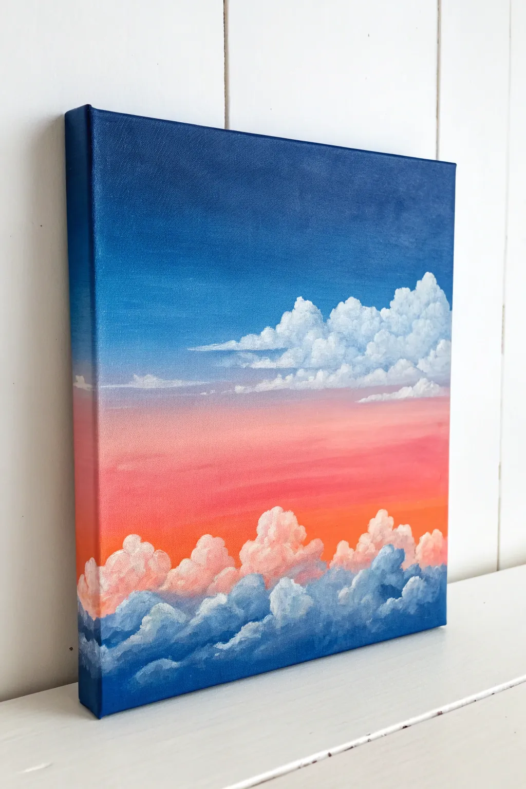 Dreamy gradient sky with fluffy clouds layered on top for an easy, modern painting idea
