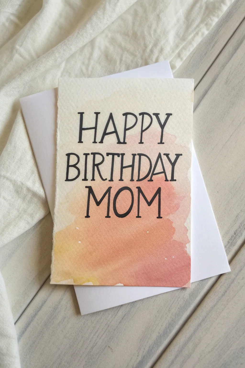 Minimal watercolor wash with bold hand-lettering for an easy, modern Mom birthday card