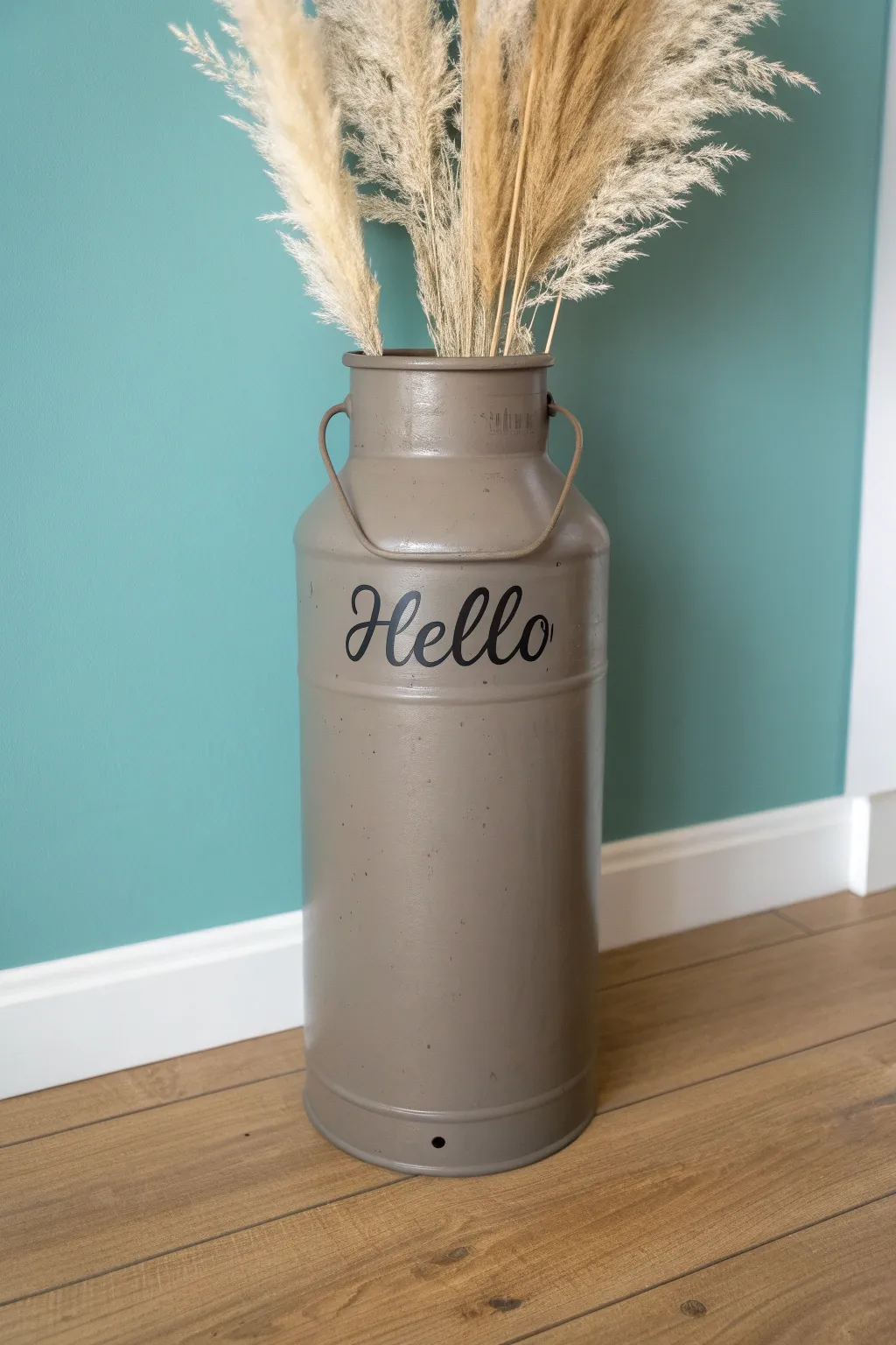 Simple painted milk can with hand-lettered Hello and tall faux stems, scandi boho porch decor.
