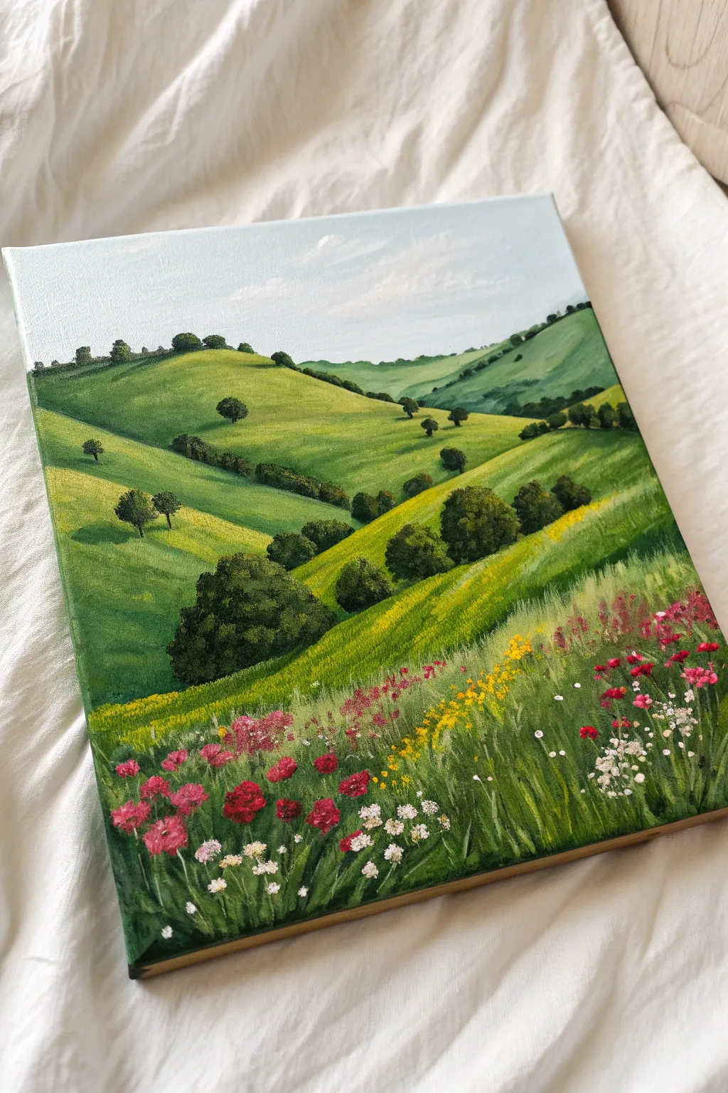 Capture the beauty of spring with this simple yet stunning wildflower meadow painting idea.