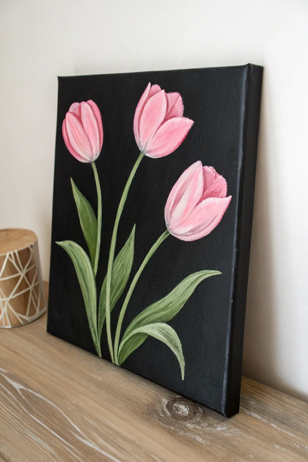 Easy black background tulips: three bold pink blooms made with simple glossy two-tone strokes