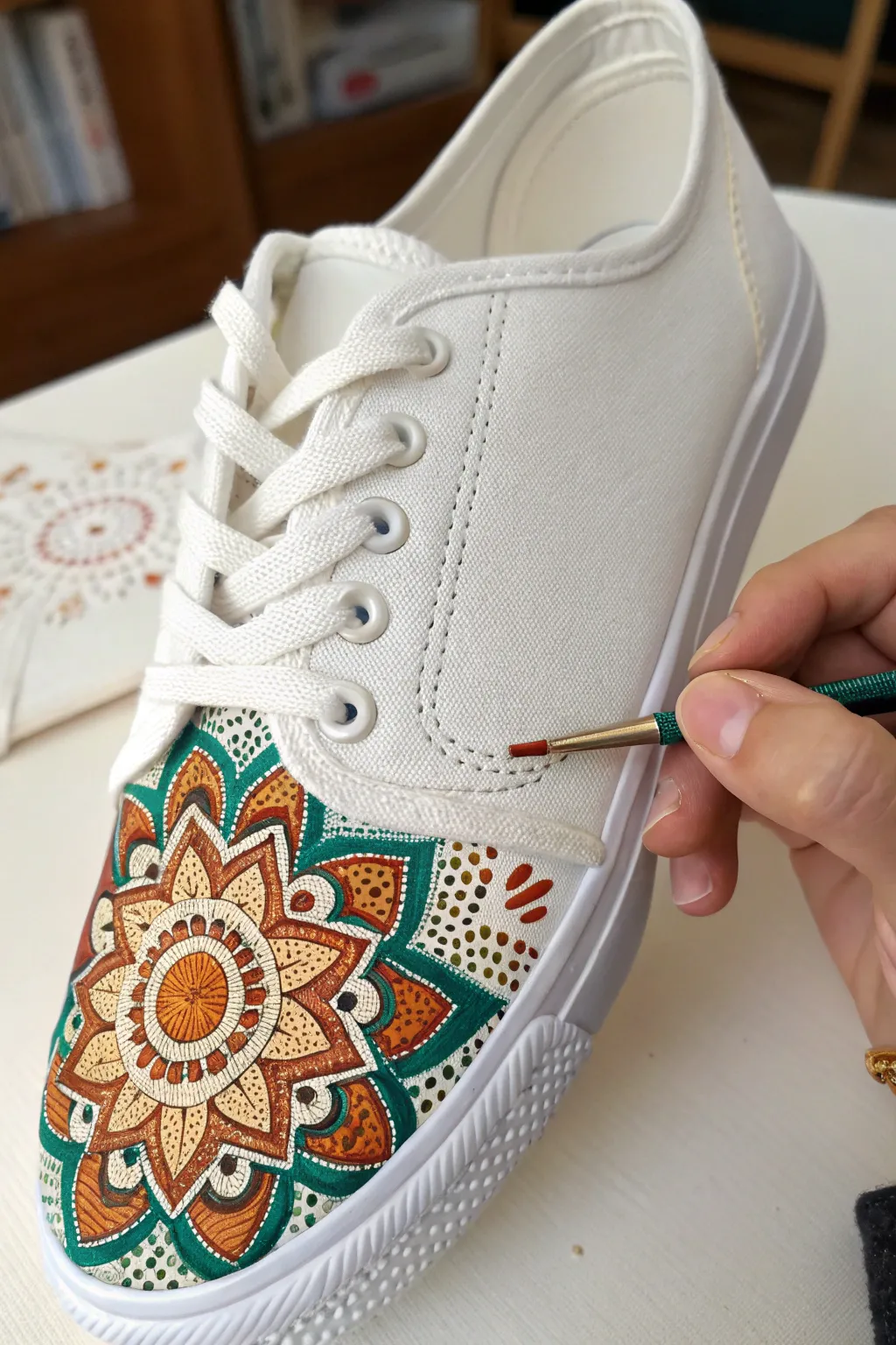 Tiny mandala dots and petals transforming a white sneaker into a bold boho minimalist gem.