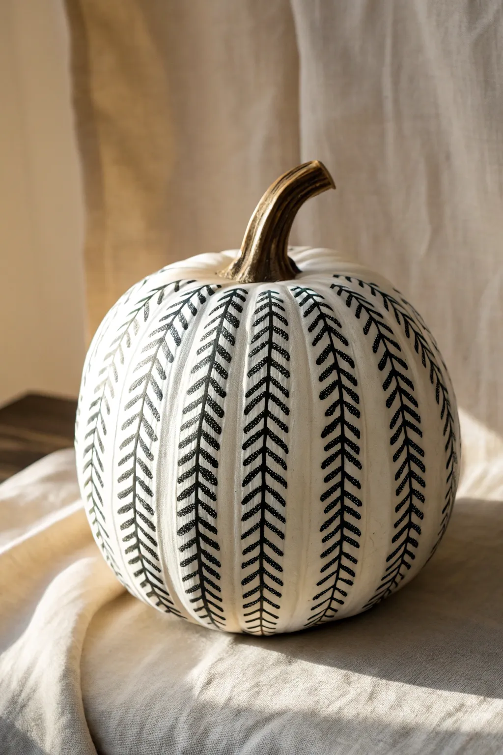 Minimal white pumpkin with bold charcoal herringbone for clean, classic texture and contrast