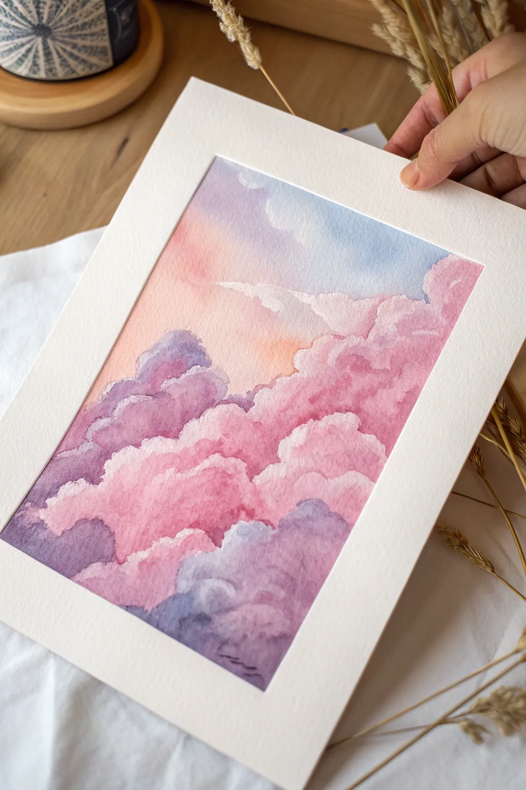 Paint dreamy cotton-candy clouds in baby pink and lavender for a soft, minimalist pink art look