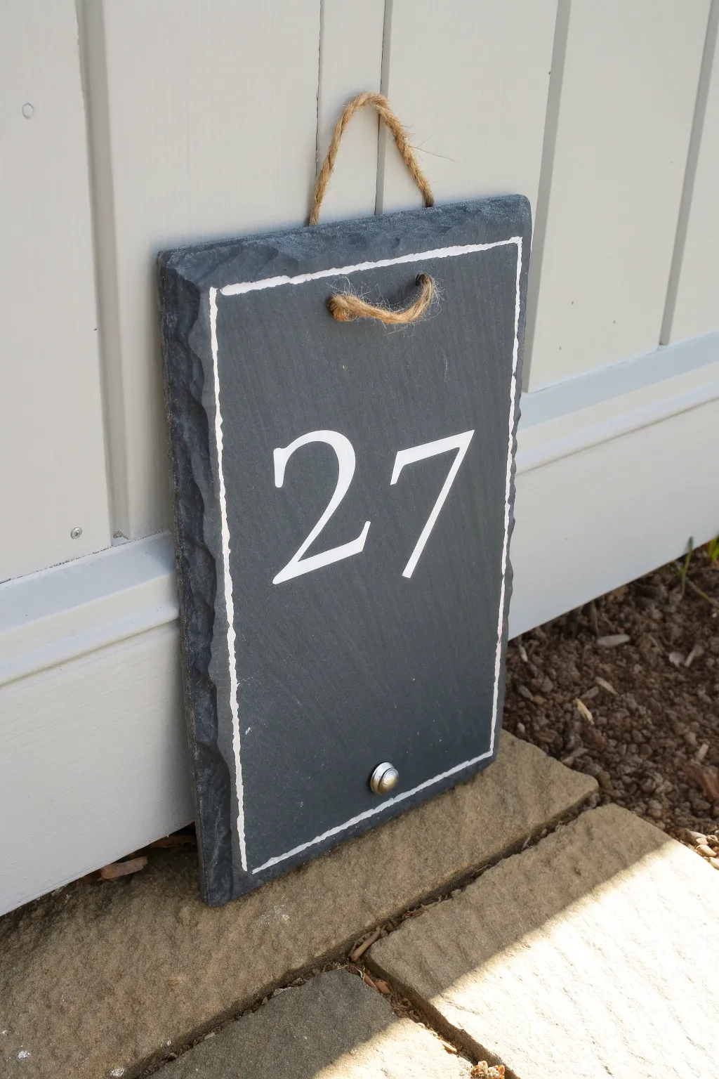 Minimalist DIY slate house number sign with crisp white paint and twine hanger, bold and clean