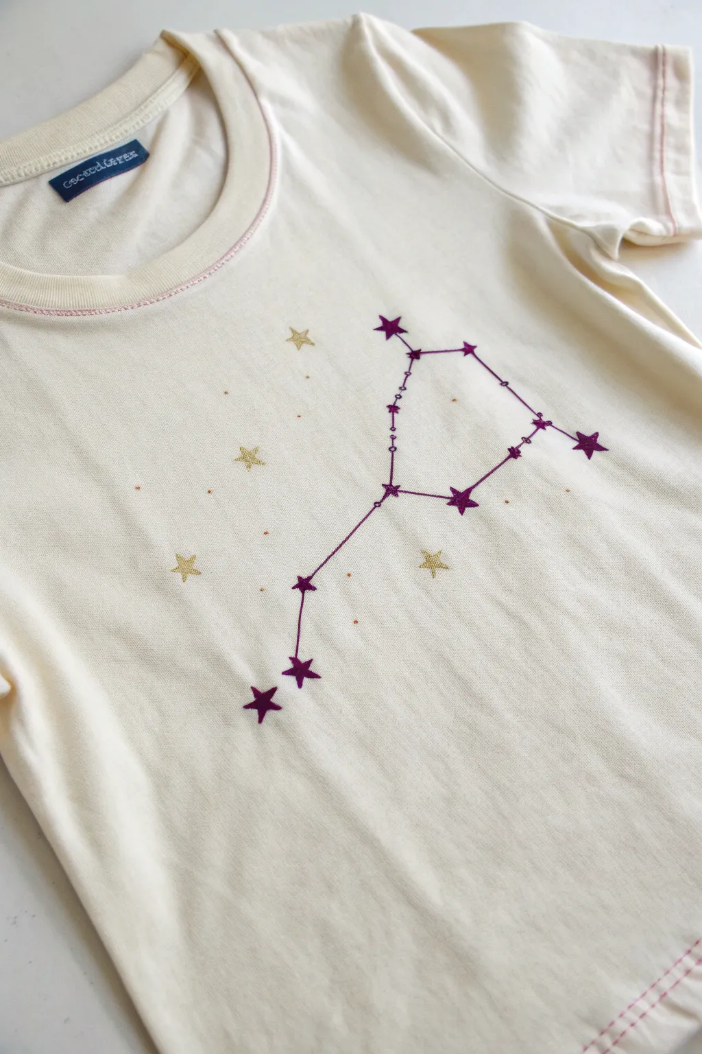 Minimalist zodiac spray paint tee with constellation dots for a chic DIY airbrush look
