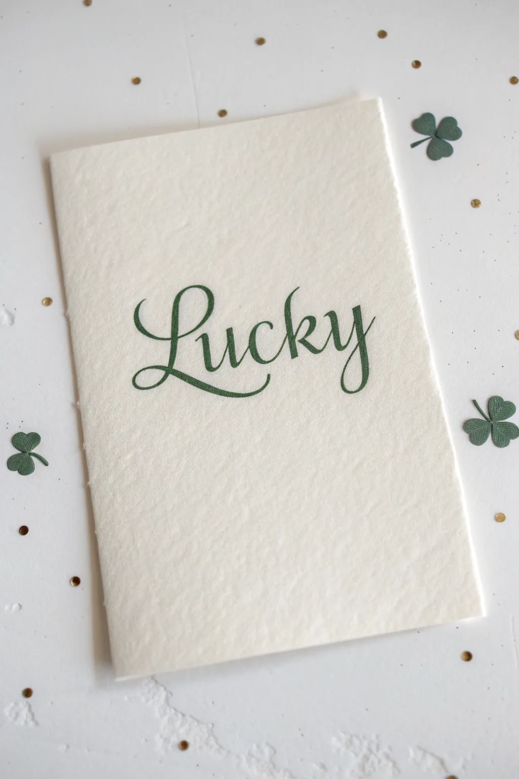 St Patricks Day drawing idea: modern hand-lettered Lucky with clover tips and subtle gold sparkle