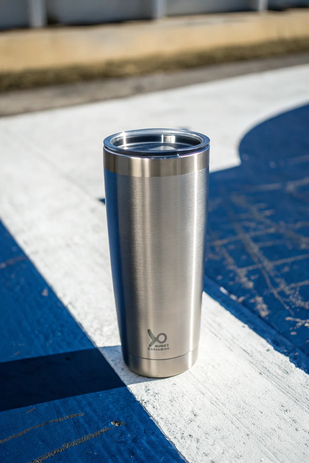 Negative space magic: stainless steel silhouette pops against a bold matte painted tumbler