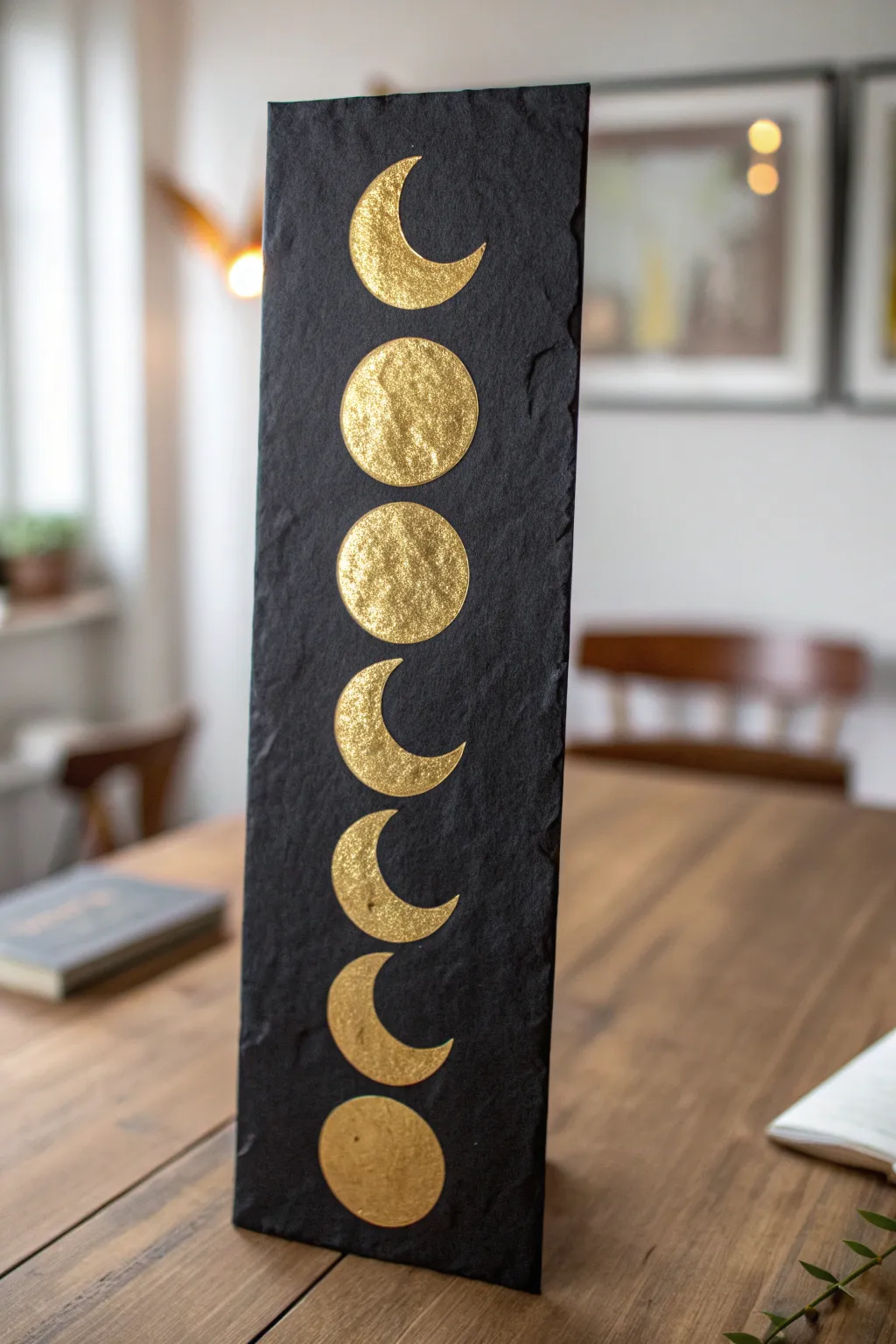 Capture celestial magic with this stunning metallic gold moon phase painting idea.