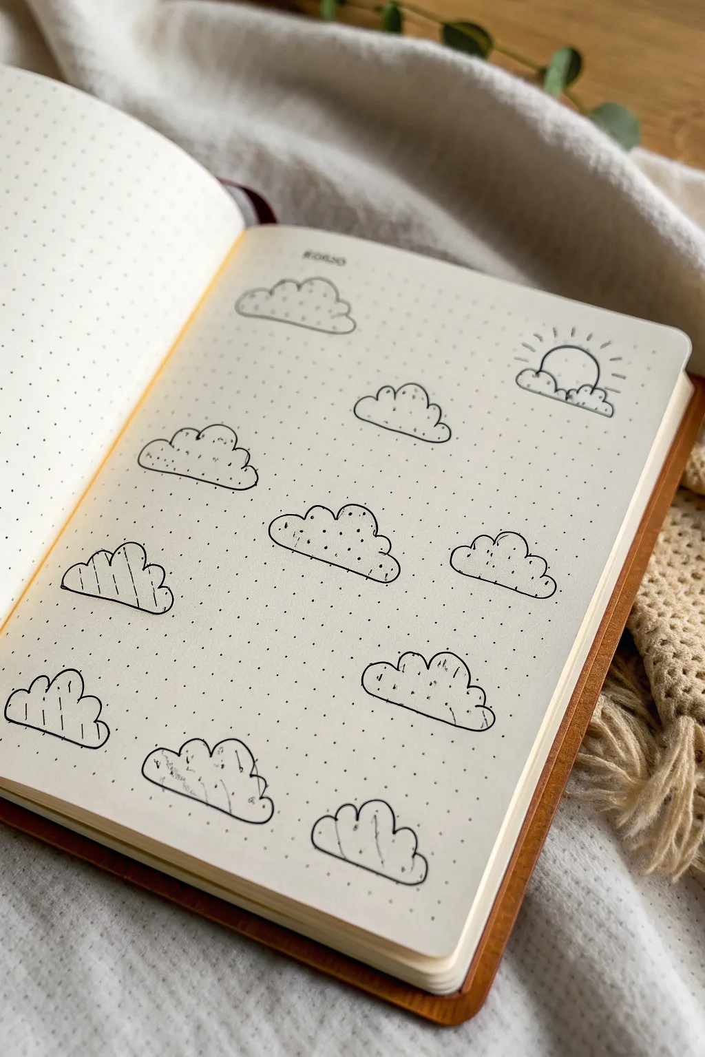 Minimal cloud doodles in clean black lines, perfect for calm Scandinavian sketchbook vibes.