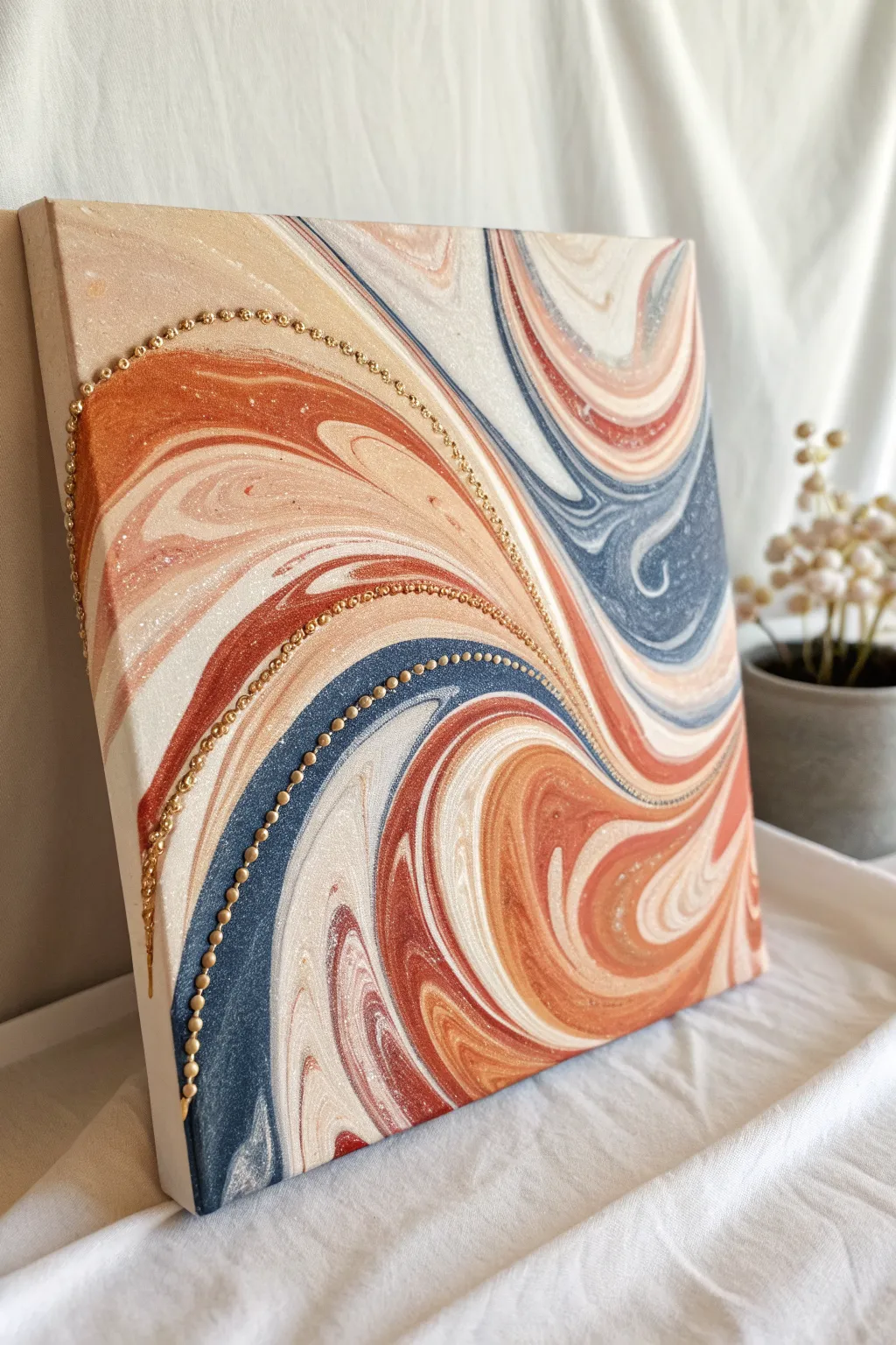 Abstract acrylic swirls with a curved bead line for minimalist boho, high-contrast wall art